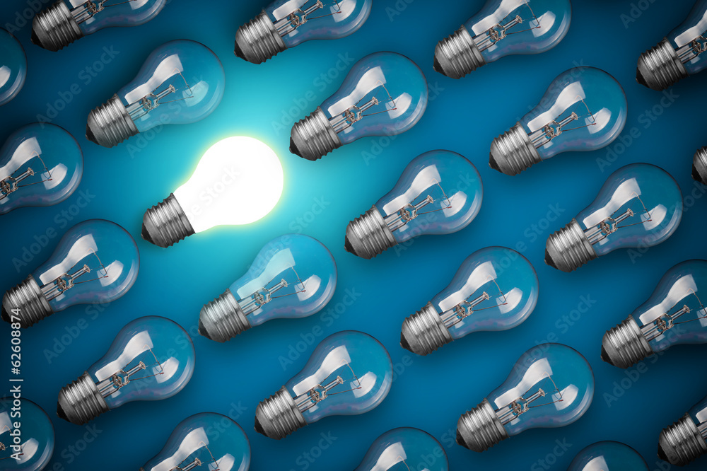 Idea concept with light bulbs on blue background