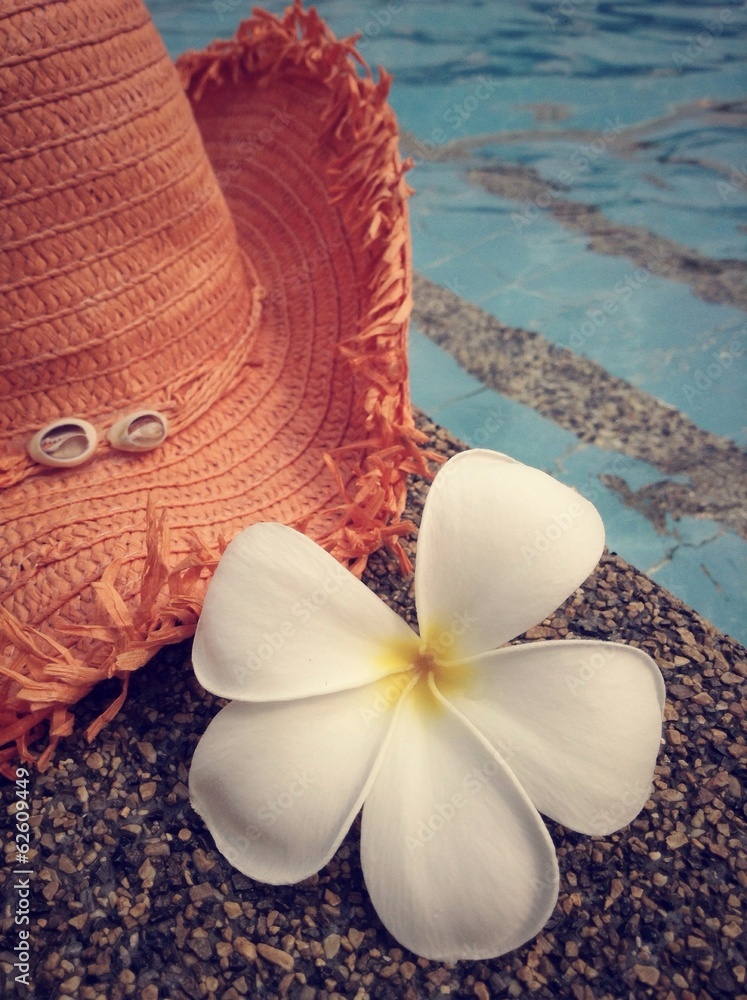 Hat, flower and poolside