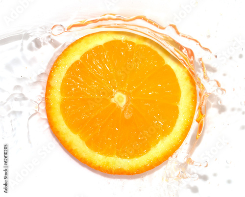 orange in water on white background