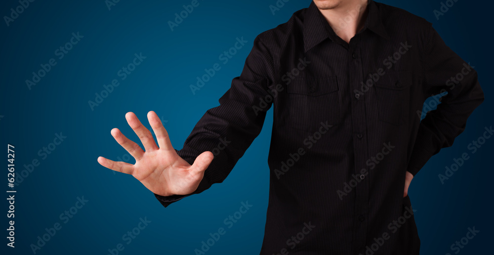 Businessman pressing imaginary button Businessman pressing imaginary button