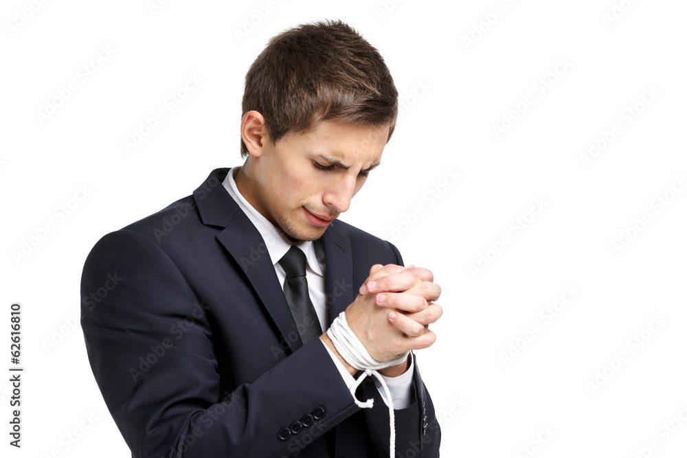 Half-length portrait of business man with tied hands Half-length portrait of business man with tied hands