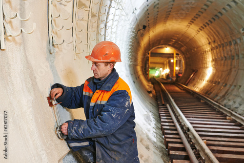 tunnel worker at underground construction site photo