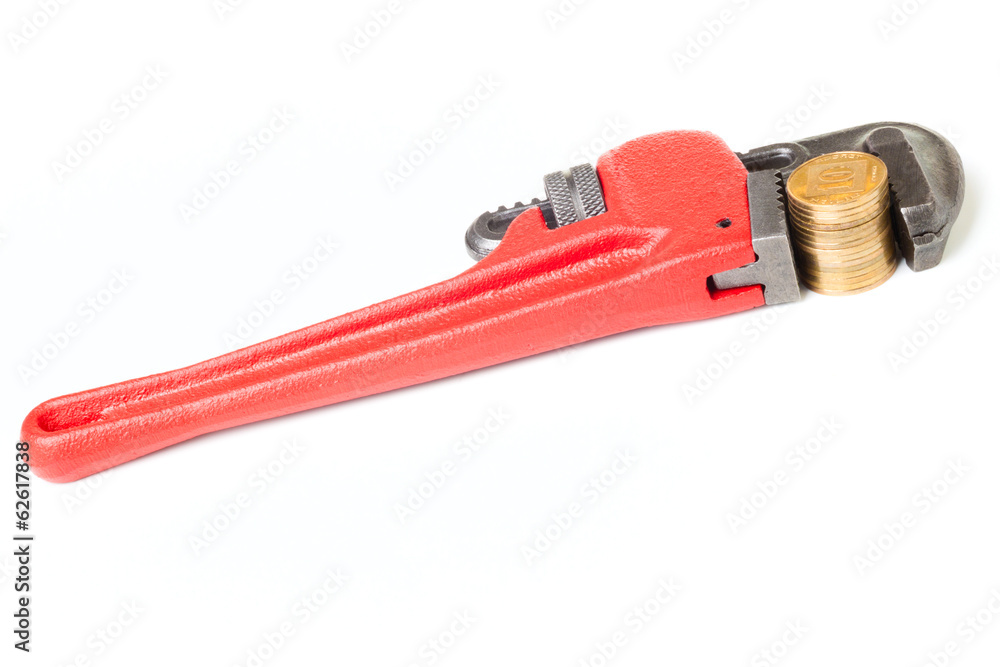 Red monkey wrench with a gold coins Red monkey wrench with a gold coins