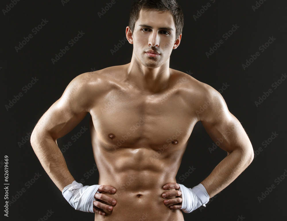 Half-length portrait of nude fighter with hands on hips Half-length portrait of nude fighter with hands on hips