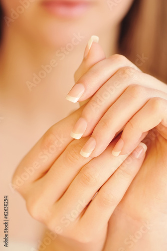 Care for beautiful woman hands. Focus on hands