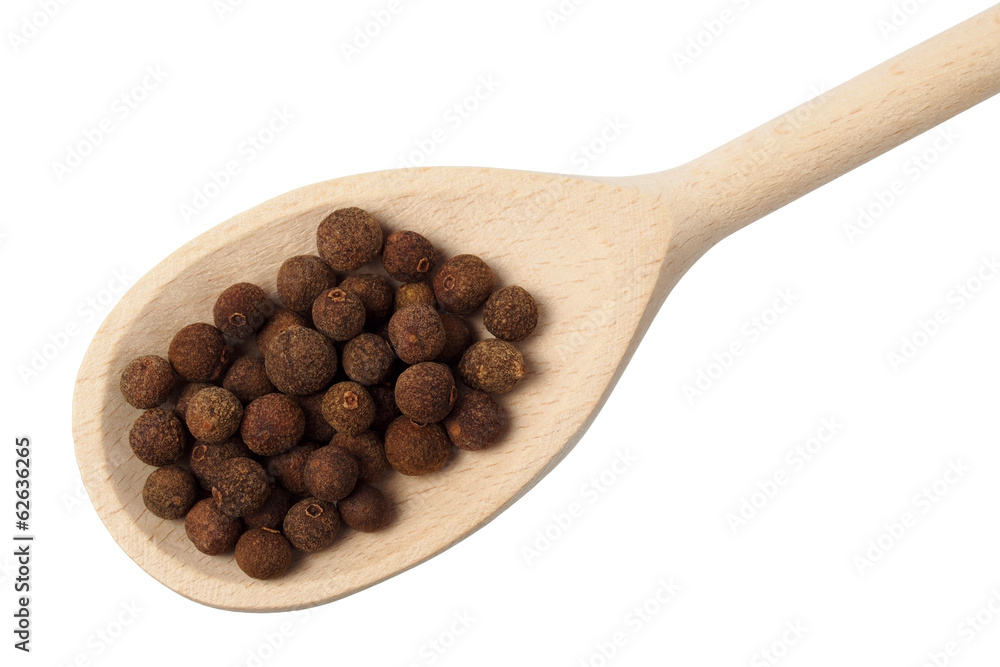 Allspice on wooden spoon Allspice on wooden spoon