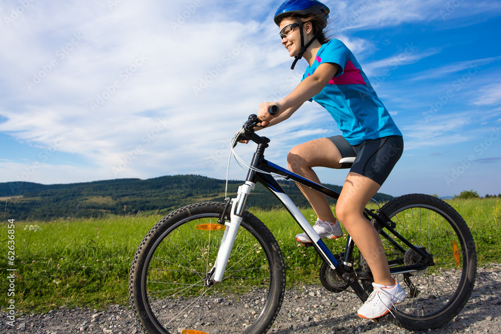 Healthy lifestyle - teenage girl biking