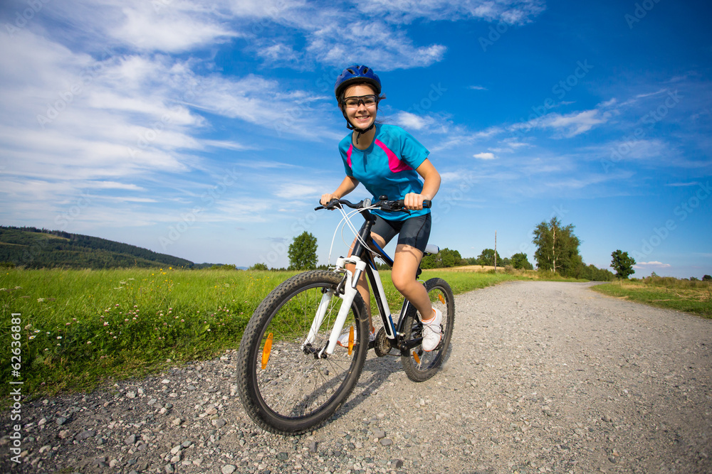 Healthy lifestyle - teenage girl biking Healthy lifestyle - teenage girl biking