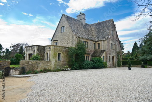 Traditional Cotswold cottages in England, UK. spring. photo