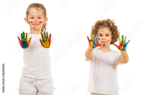 Little sisters girls showing painted hands
