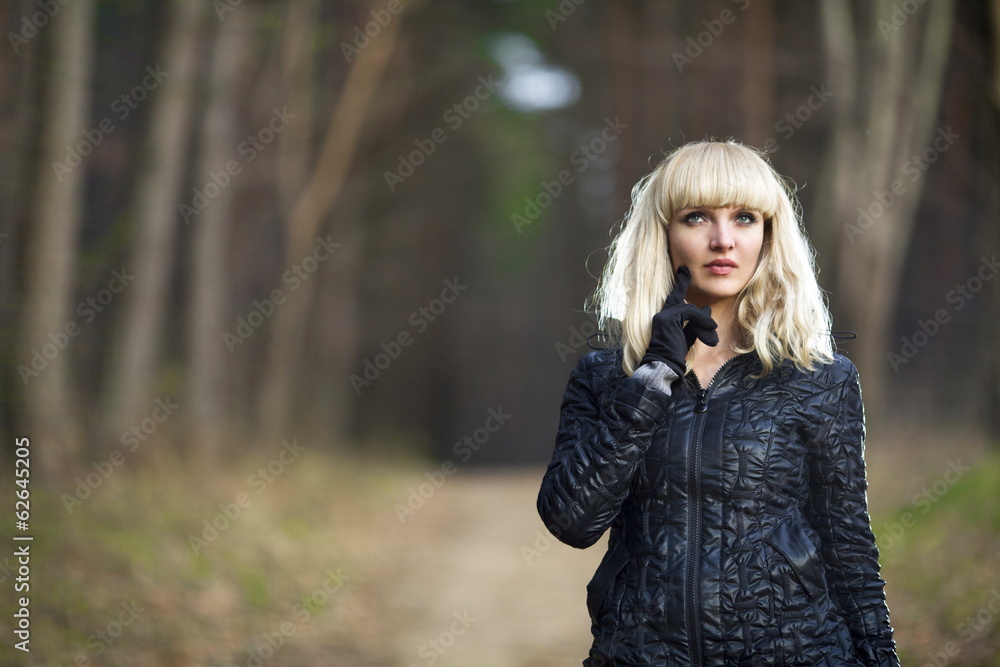 Beautiful young woman walks on autumn park Beautiful young woman walks on autumn park
