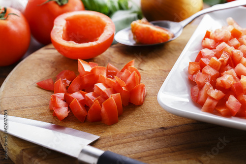 sliced ​​tomato cubes on the board photo