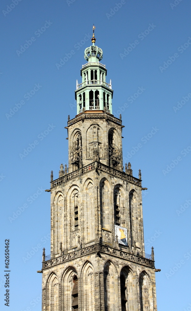 Martini tower from 1482 against a blue sky in Groningen