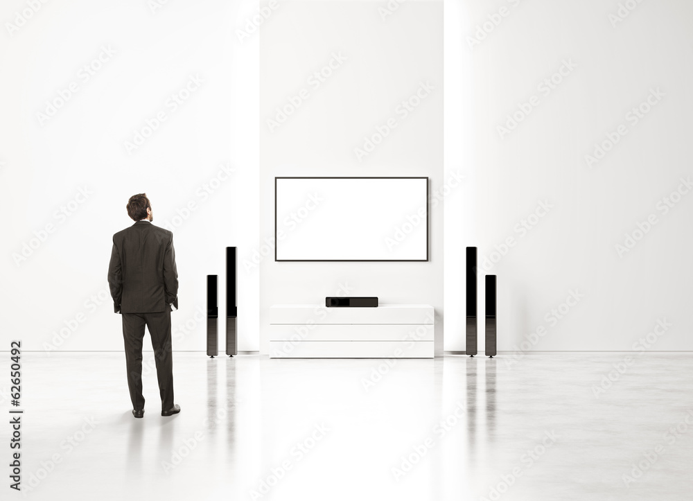 Fototapeta premium Businessman watching home cinema