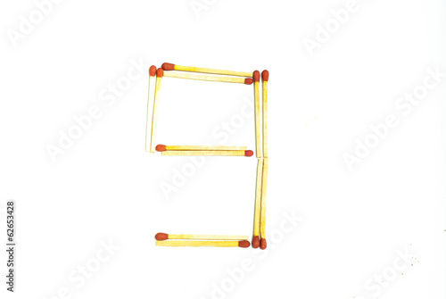 Numbers 9 made of matches on a white background