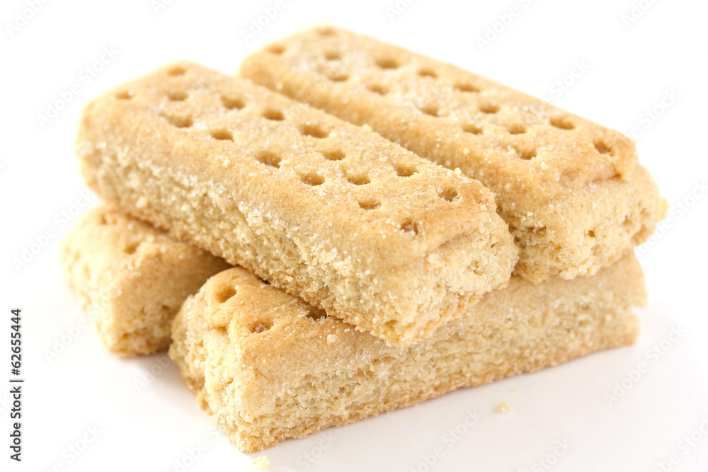 Classic shortbread finger biscuits on white surface