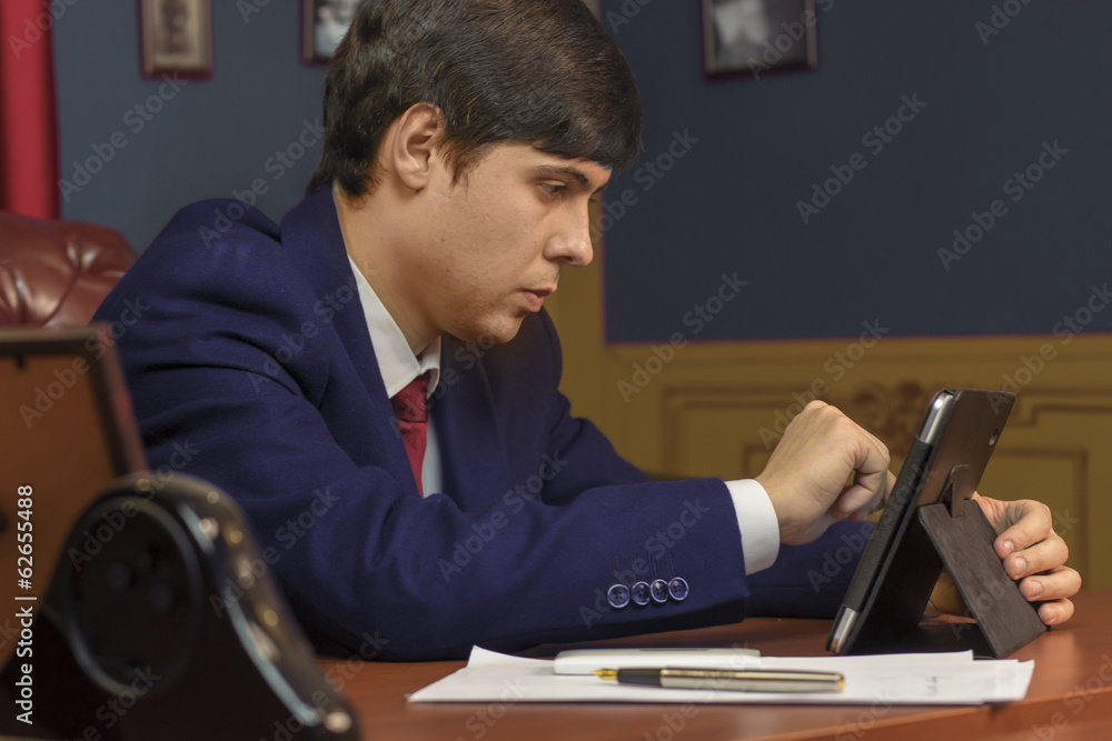 Company Director manager in suit, CEO desk, tablet PC Company Director manager in suit, CEO desk, tablet PC