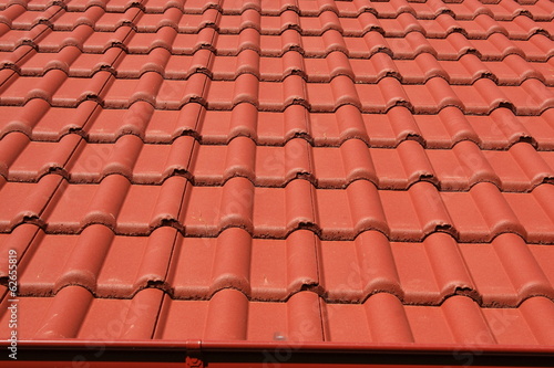 Concrete roof covered with red tiles