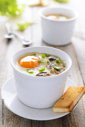 Baked egg with mushrooms and toast
