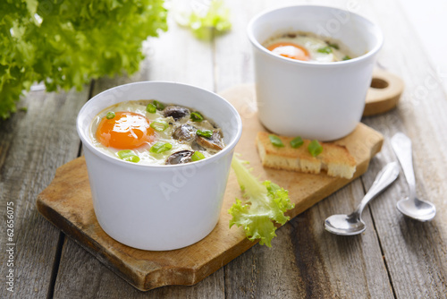 Baked eggs with mushrooms, cream and chives - healthy breakfast