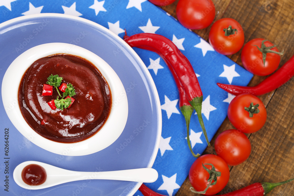 Tomato sauce in bowl on wooden table close-up Tomato sauce in bowl on wooden table close-up