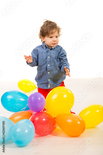 Elegant baby boy with balloons