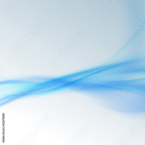 Abstract blue waves over white background © phyZick