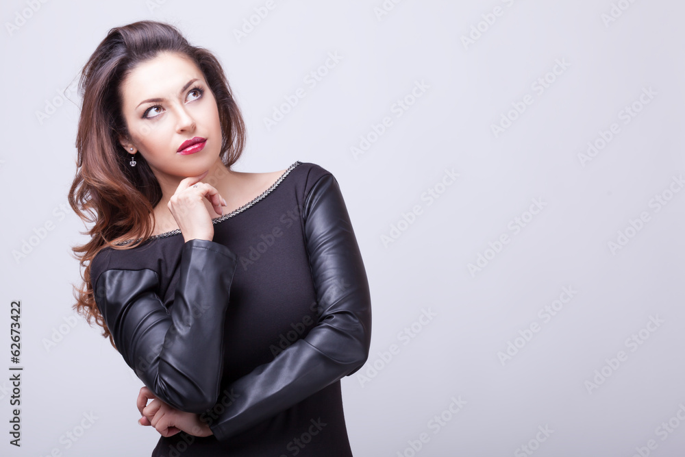 Gorgeous woman on grey background Gorgeous woman on grey background