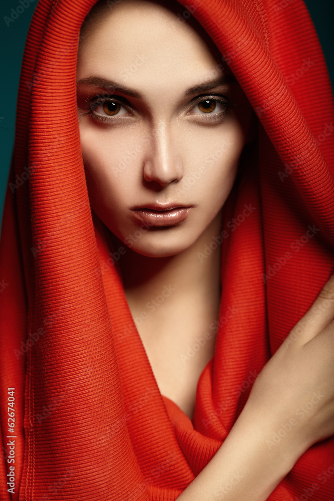 Beautiful woman with red hood. Fashion.