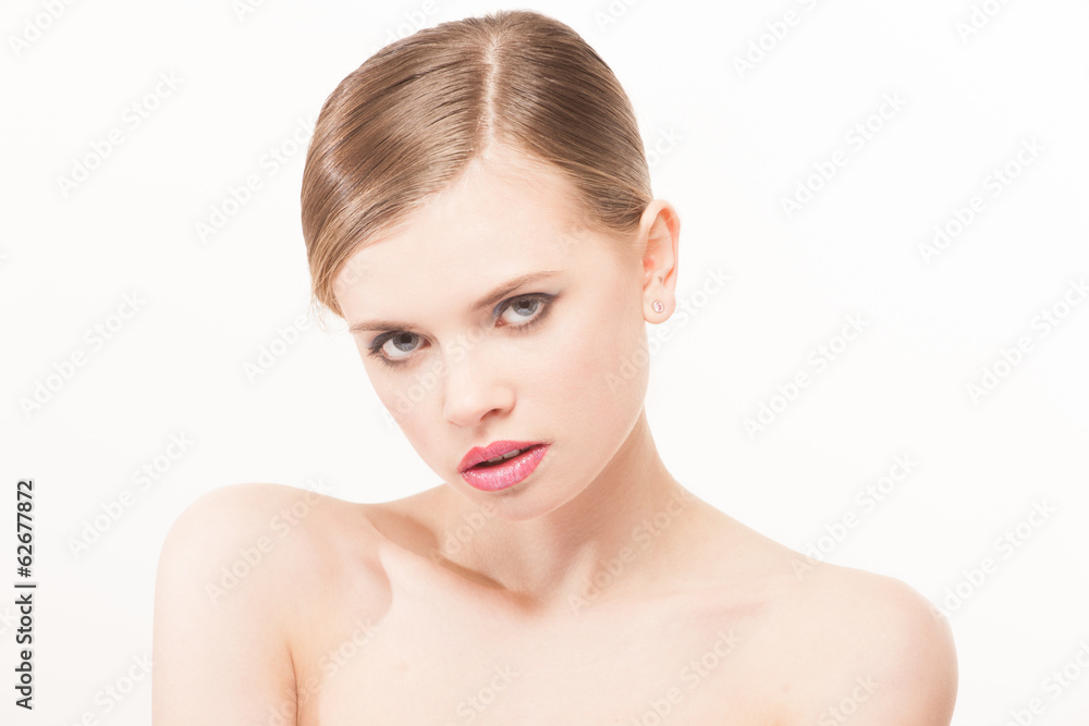 Portrait of beautiful young woman with clean face. High key shot Portrait of beautiful young woman with clean face. High key shot