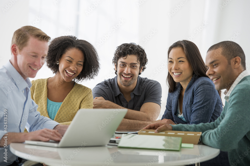 Business Meeting. A Group Sitting Down Around A Table. Business Meeting. A Group Sitting Down Around A Table.