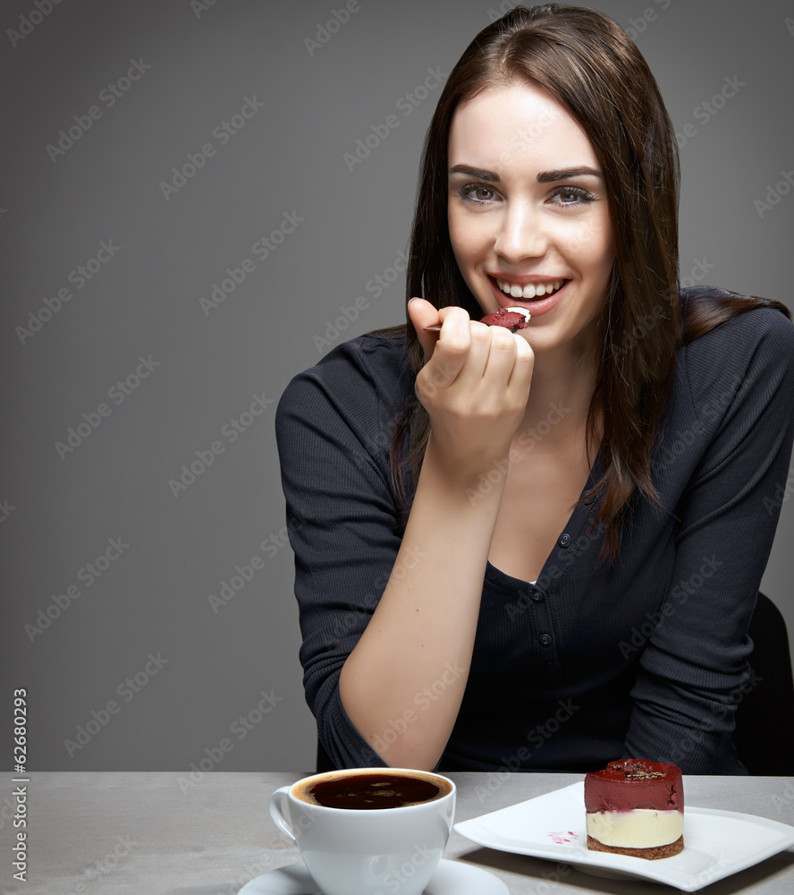 young woman eating chocolate cake