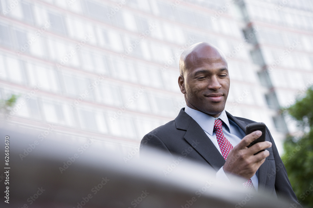 Business People. A Man In A Suit Checking His Phone. Business People. A Man In A Suit Checking His Phone.