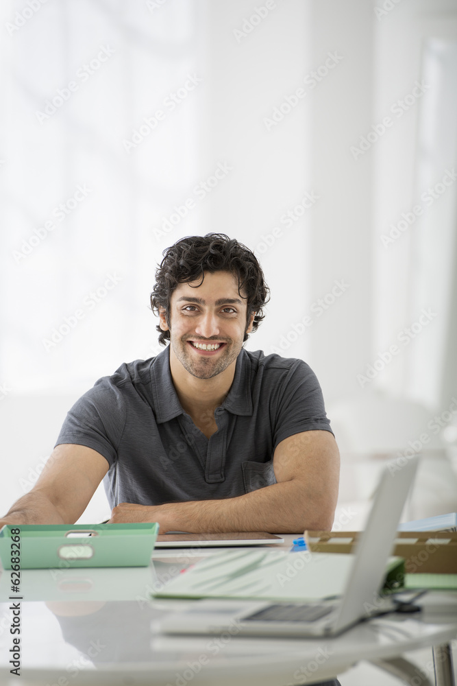 Business. A Man Sitting In A Relaxed Pose Behind A Desk. Business. A Man Sitting In A Relaxed Pose Behind A Desk.