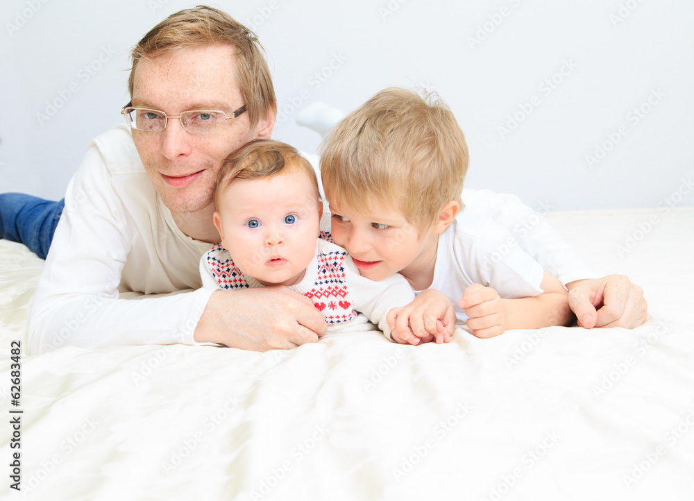 father with infant daughter and little son father with infant daughter and little son