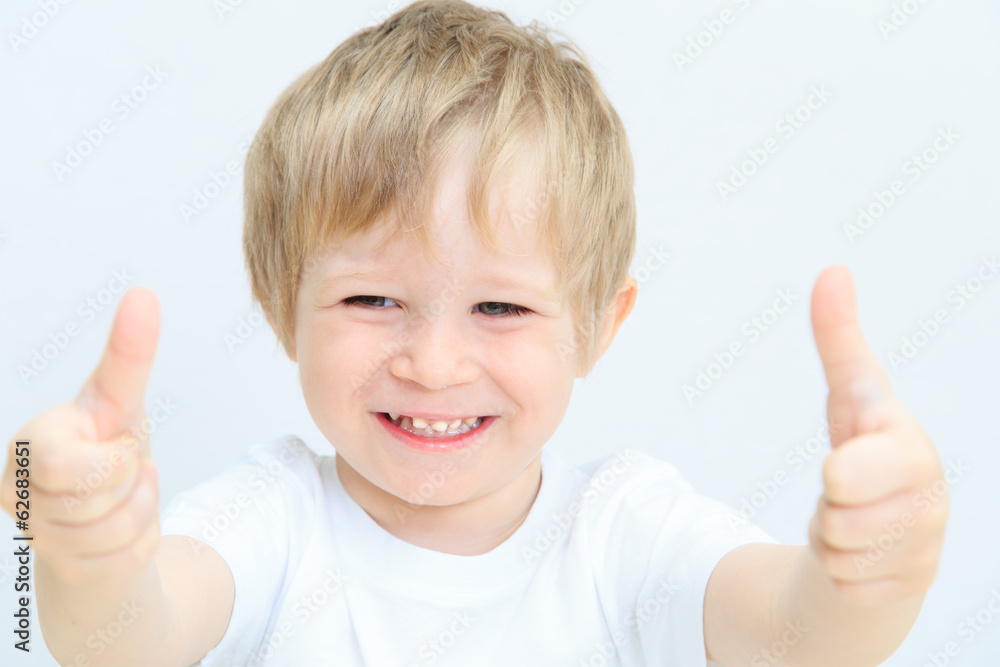 happy little boy with thumbs up on white happy little boy with thumbs up on white