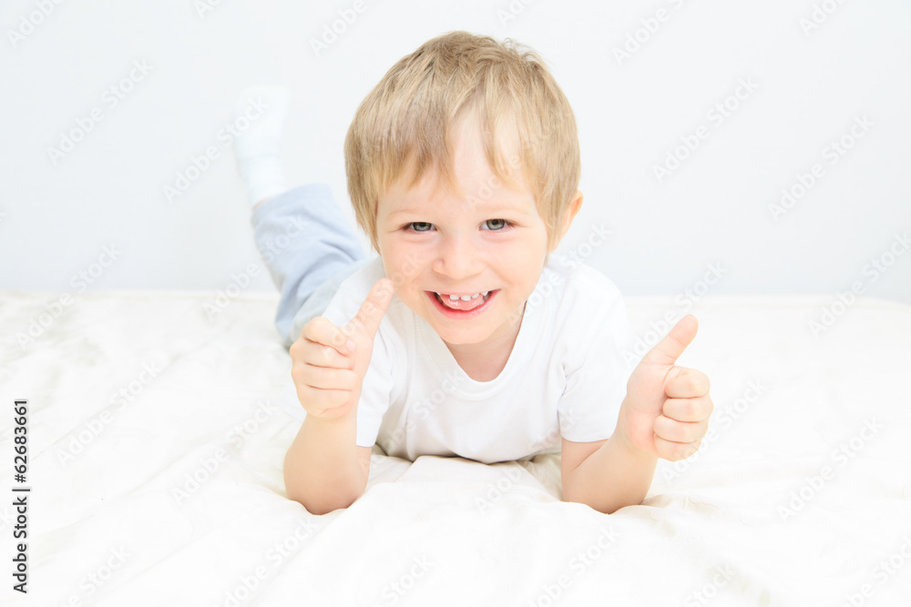 happy little boy with thumbs up on white happy little boy with thumbs up on white