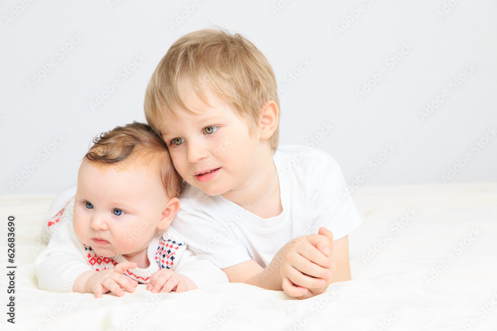 portrait of little boy with newborn sister portrait of little boy with newborn sister