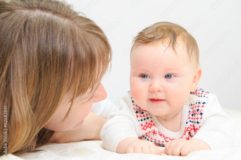 mother with newborn daughter in bed mother with newborn daughter in bed