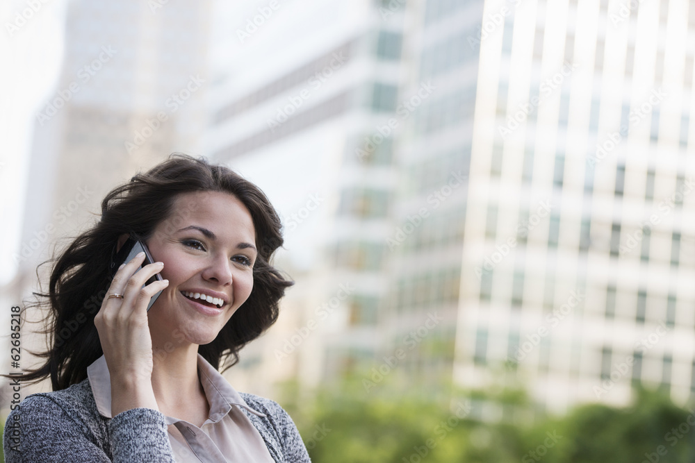 Business People. A Businesswoman In A Light Grey Jacket, Using Her Smart Phone. 