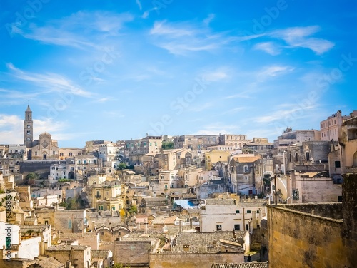 panoramic view of stones of Matera under blue sky © donfiore
