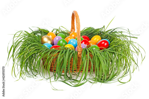 Canvas Print Colorful easter eggs in basket