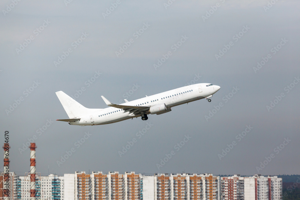 Naklejka premium white plane takes off from the runway