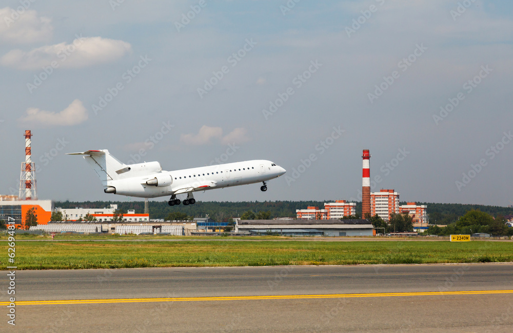 Fototapeta premium white plane takes off