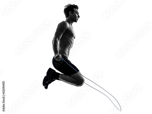 young man exercising jumping rope silhouette