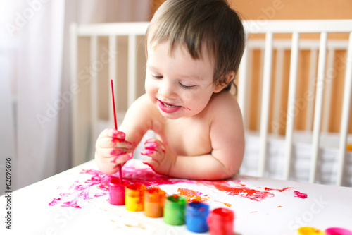 18 months baby with paints