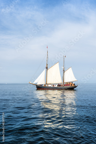 Tall ship on blue water vertical