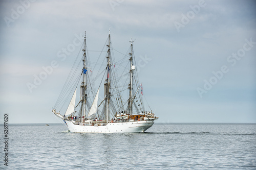 Tall ship on blue water horizontal