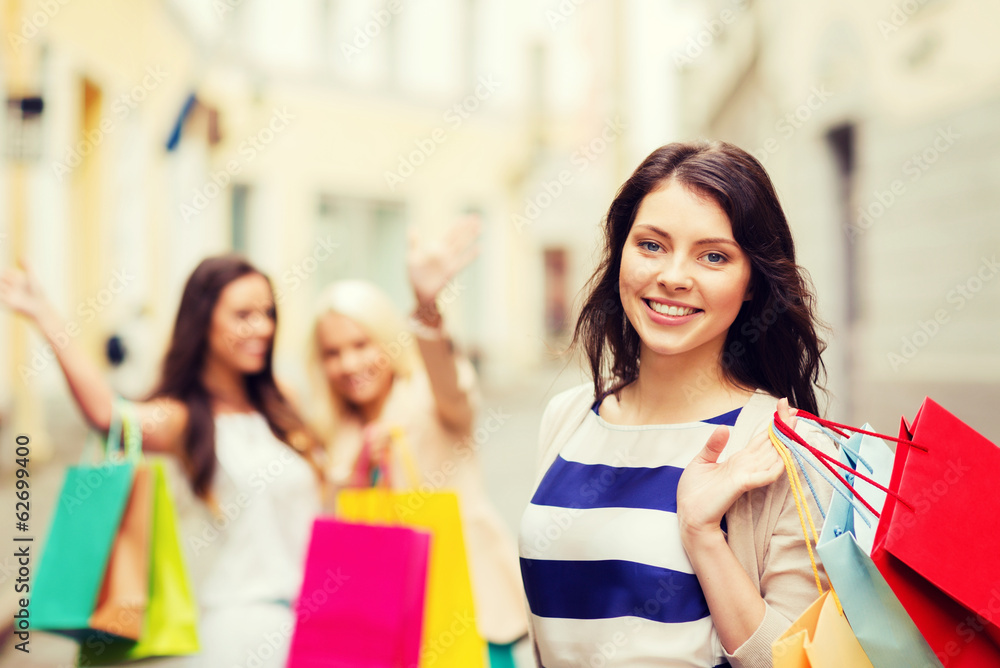 girls with shopping bags in city girls with shopping bags in city