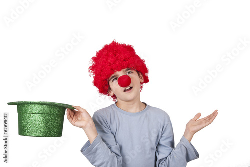 boy with clown nose and hat isolated on white background photo